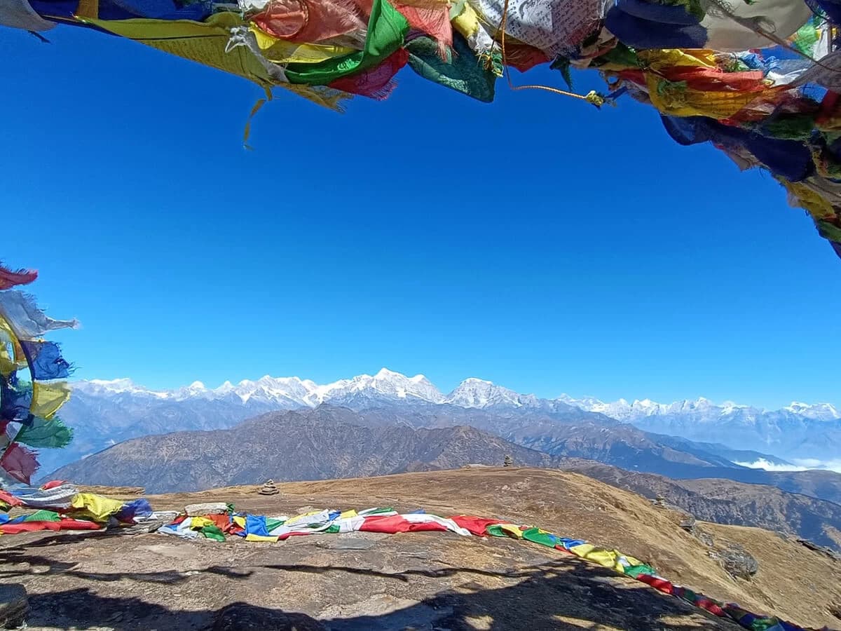 Prayer flags frame the magnificent Himalayan panorama from Pikey Peak.