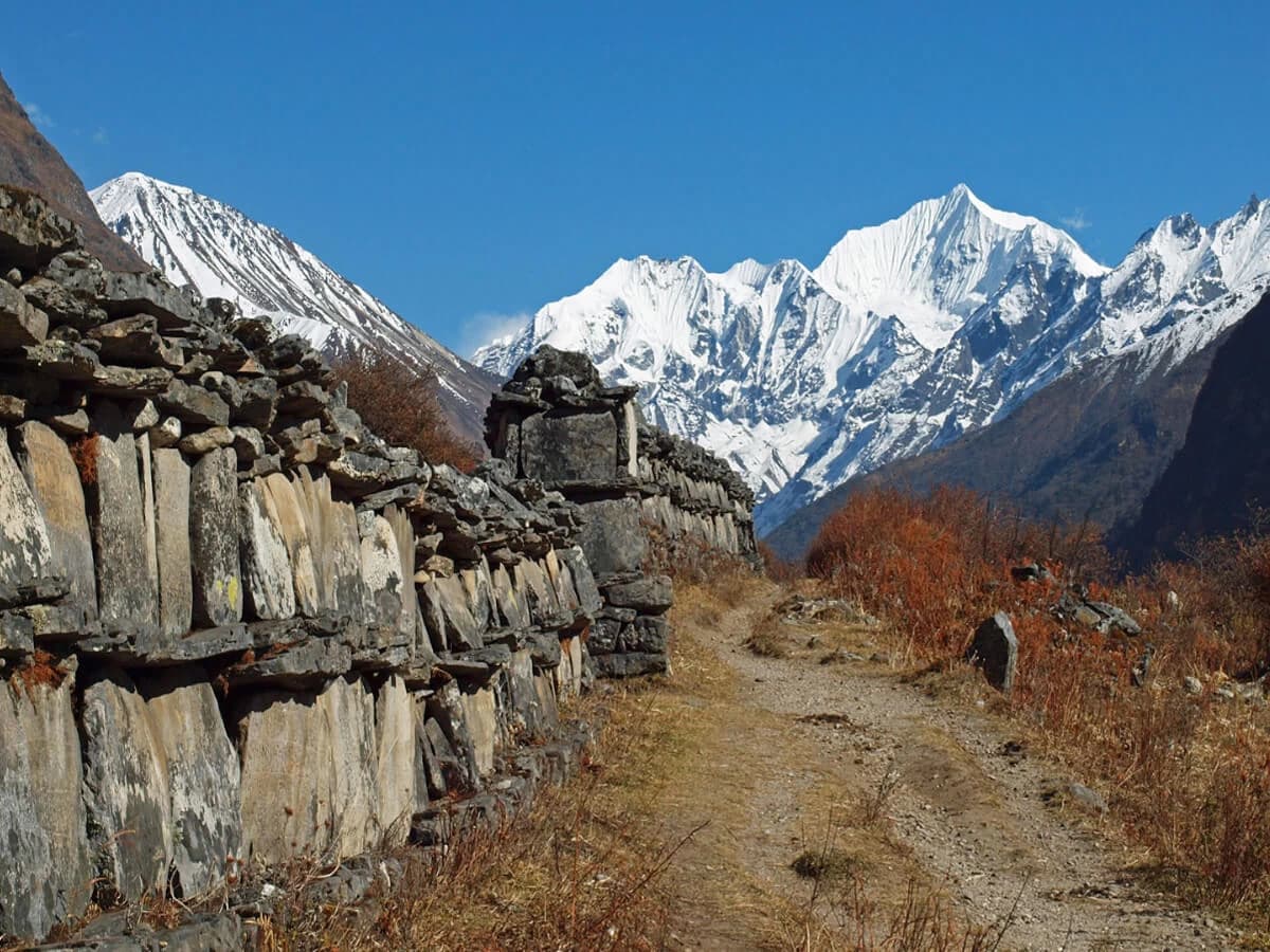 Prayers engraved stone wall in Langtang
