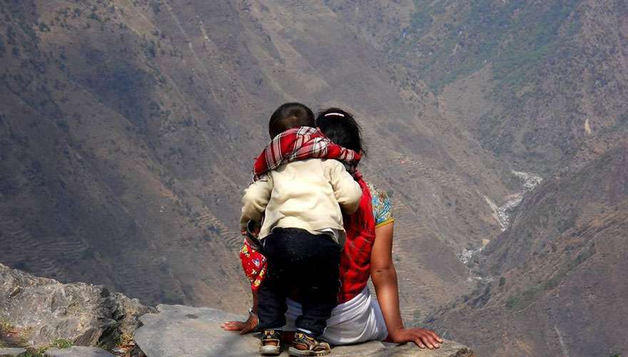 A young mother and her child enjoys the view